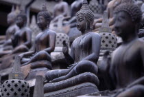 Gangaramaya Temple. Mass of seated Buddha statuesAsia Asian Llankai Religion Sri Lankan