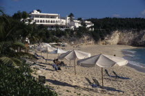 Samana beach with people sunbathing on loungers and parasolsBeaches Caribbean Holidaymakers Resort Sand Sandy Seaside Shore Sunbather Tourism Tourist Tourists Travel West Indies