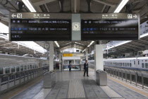 Tokyo Station  a bilingual train departure display on the platform.scheduleinformationtime Asia Asian Japanese Nihon Nippon