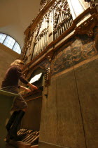 Looking up at the 17th century baroque organ played by a masters student  at the Memorial Art Gallery.American North America United States of America
