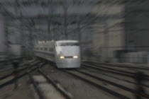 A bullet train  hikari shinkansen  arrives at Tokyo Stationblur movement Asia Asian Japanese Nihon Nippon