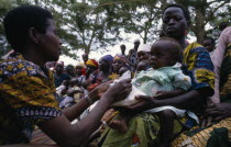 Health worker giving nutritional advice to mothers with vulnerable babies during food distribution at Orukinga refugee camp near the Rwandan border.
