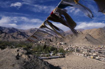 Prayer flags on hillside above Leh spread out across valley below.Asia Asian Bharat Inde Indian Intiya Religion Religious Scenic