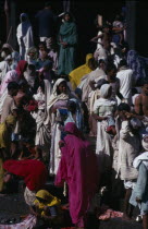 Crowds on steps to bathing pool and waiting to enter temple.Asia Asian Nepalese Religion Religious