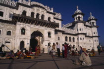 Janaki Mandir exterior facade with street traders  beggar and crowds in square in the foreground.Sita temple Asia Asian Kids Nepalese Religion Religious