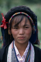 Head and shoulders portrait of Bouyei girl in traditional dress.Asia Asian Chinese Chungkuo Classic Classical Historical Immature Jhonggu Older One individual Solo Lone Solitary Zhonggu 1 History S...
