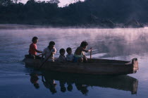 Ava-Canoeiros people canoeing on the River Tocantins near their settlement.