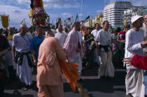 Hare Krishna taking part in a parade on Brighton seafrontEuropean Great Britain Northern Europe UK United Kingdom