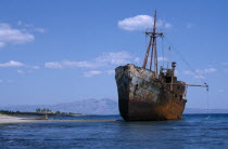 Shipwreck in shallow water next to sandy beachEuropean Beaches Ellada Greek Resort Seaside Shore Southern Europe Tourism