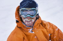 Close up of skier wearing protective snow goggles.