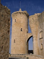 Palma.  Circular defence tower and bridge of fourteenth century Belver Castle with tourist visitor just seen above wall.Majorca 14th c.fortified fortress defensive Castillo Castello Defense Espainia...