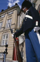 Royal guards with bayonet rifels standing outside the palace