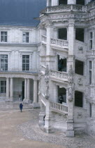 Exterior view of ornate spiral staircase and courtyard of the Chateau.