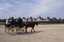 Tourist horse and cart travelling through grounds
