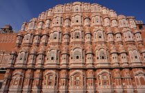 Hawa Mahal or Palace of the Winds.  Cropped view of semi-octagonal  honeycombed pink sandstone exterior facade.