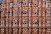 Hawa Mahal or Palace of the Winds  constructed in 1799.  Cropped view of pink  semi-octagonal  honeycombed sandstone facde.