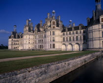 Chambord Palace seen from across water and formal gardens