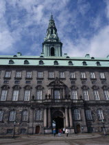 Christiansborg Palace. Home of the Danish Parliament. Exterior view with green copper roof and visitors walking through.