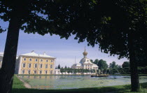 Puskin palace viewed from under tree branches