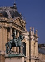 Palace detail with bronze statue of man on horse