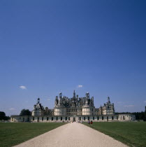 Chambord Chateau. Long straight gravelled driveway with tourists