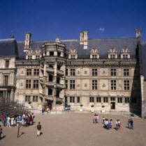 Blois Chateau. Tourists at entrance with circular external staircase