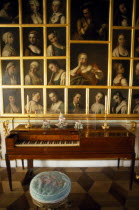 Great Palace.  Interior of state room with piano and portraits.