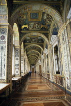 Hermitage Museum.  View along loggia displaying paintings by Raphael with visitors at far end.