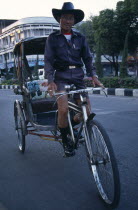 Cyclo driver on his bike.Asian Prathet Thai Raja Anachakra Thai Siam Southeast Asia Siamese