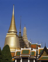 Aka the Grand Palace. Colourful rooftops and spires with golden spire in the foreground.