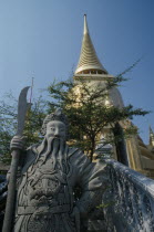 Wat Phra Kaew. Statue standing by steps looking up to golden spirePrathet Thai Raja Anachakra Thai Religion Siam Southeast Asia Asian Religious Siamese