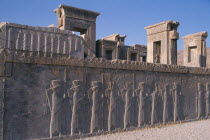 Fifth century BC Archaemenid palace complex. Xerxes Palace wall with stone relief -carved frieze of a procession of delagates.