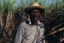 Haitian sugar cane cutter.  Head and shoulders portrait.