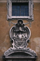 Piazza del Campidoglio.  Exterior detail of the Palazzo Senatorio or Senators Palace with carved stone heraldic coat of arms.