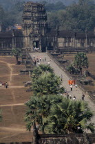 Elevated view over causeway leading to library.Asian Cambodian Kampuchea Religion Southeast Asia History Holidaymakers Kamphuchea Religious Tourism Tourist Sightseeing Tourists