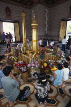 Wat Meuang the City pillar the most important animist shrine in Bangkok with devotees making offeringsAsian Prathet Thai Raja Anachakra Thai Religion Siam Southeast Asia Religious Siamese