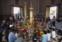 Wat Meuang the City pillar the most important animist shrine in Bangkok with devotees making offeringsAsian Prathet Thai Raja Anachakra Thai Religion Siam Southeast Asia Religious Siamese