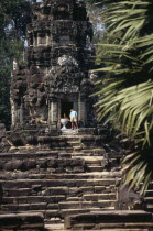 Neak Pean.  Child at entrance to small temple on circular terrace.Asian Cambodian Kampuchea Kids Religion Southeast Asia Children History Kamphuchea Religious