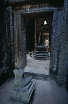 Preah Khan.  Headless seated Buddha figure and burial stuppa.Asian Cambodian Kampuchea Religion Southeast Asia History Kamphuchea Religious