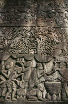 The Bayon.  Bas relief carvings on the south wall depicting everyday scenes.  Cooking wild boar in a kitchen.Asian Cambodian Kampuchea Southeast Asia History Kamphuchea