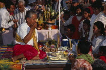 Shaman at ceremony smelling the offerings of food brought by the Khmer peopleAsian Cambodian Kampuchea Religion Southeast Asia Kamphuchea Religious