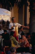 Shaman at ceremony blessing devotees with the holy waterAsian Cambodian Kampuchea Religion Southeast Asia Kamphuchea Religious