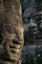 The Bayon.  Detail of huge carved face thought to be that of King Jayarvarman VII.Asian Cambodian History Kampuchea Religion Southeast Asia Kamphuchea Religious