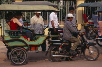 Two female tourists sitting in a stationary tuk tukAsian Cambodian Kampuchea Southeast Asia 2 Holidaymakers Kamphuchea Tourism