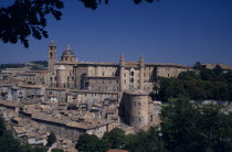 Palazzo Ducale  Renaissance palace above the town. View through trees.