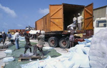 Loading French food aid of wheat flour onto truck for distribution from Mogadishu port.African Cereal Grain Crop Eastern Africa Lorry Somalian Soomaliya Van