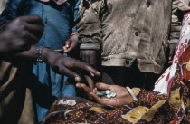 Distribution of medicines by aid workers.  Cropped shot.Giving  receiving  hands  African Eastern Africa Ethiopian