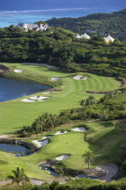 Raffles Resort Trump International Golf Course designed by Jim Fazio. The 16th green which is the longest par 3 in the world  the 17th fairway with the resort and coral reef beyond
