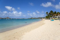 Reduit Beach in Rodney Bay with tourists in the water and on the beach with yachts at anchor in the bayCaribbean West Indies Windward Islands Beaches Holidaymakers Resort Sand Sandy Scenic Seaside Sh...