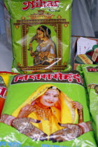 Plastic packets of henna for sale illustrated with pictures of attractive women with henna patterns on hands and wrists.fashiondecorationculturecosmeticsbeautybody paintingweddingAsia Asian Bharat Female Woman Girl Lady Inde Indian Intiya Marriage Rajasthani